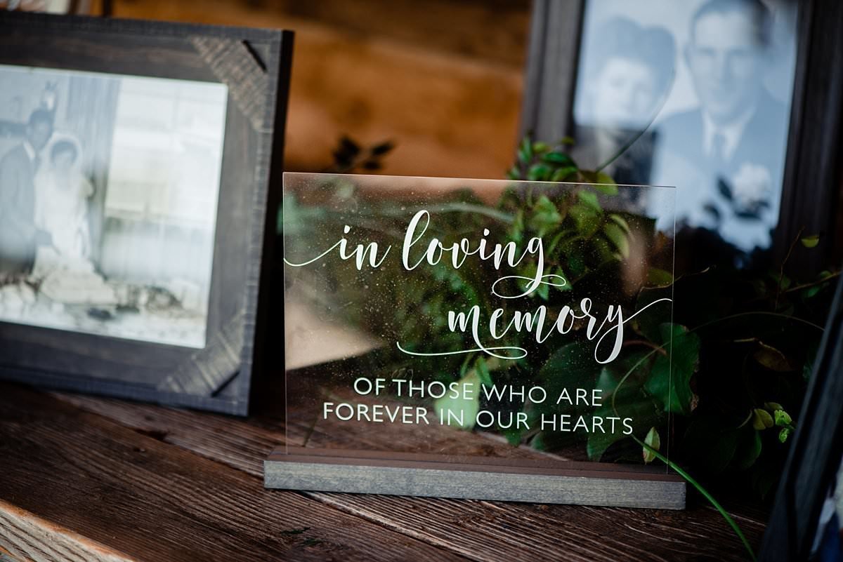 Acrylic in loving memory sign on the memorial table at reception