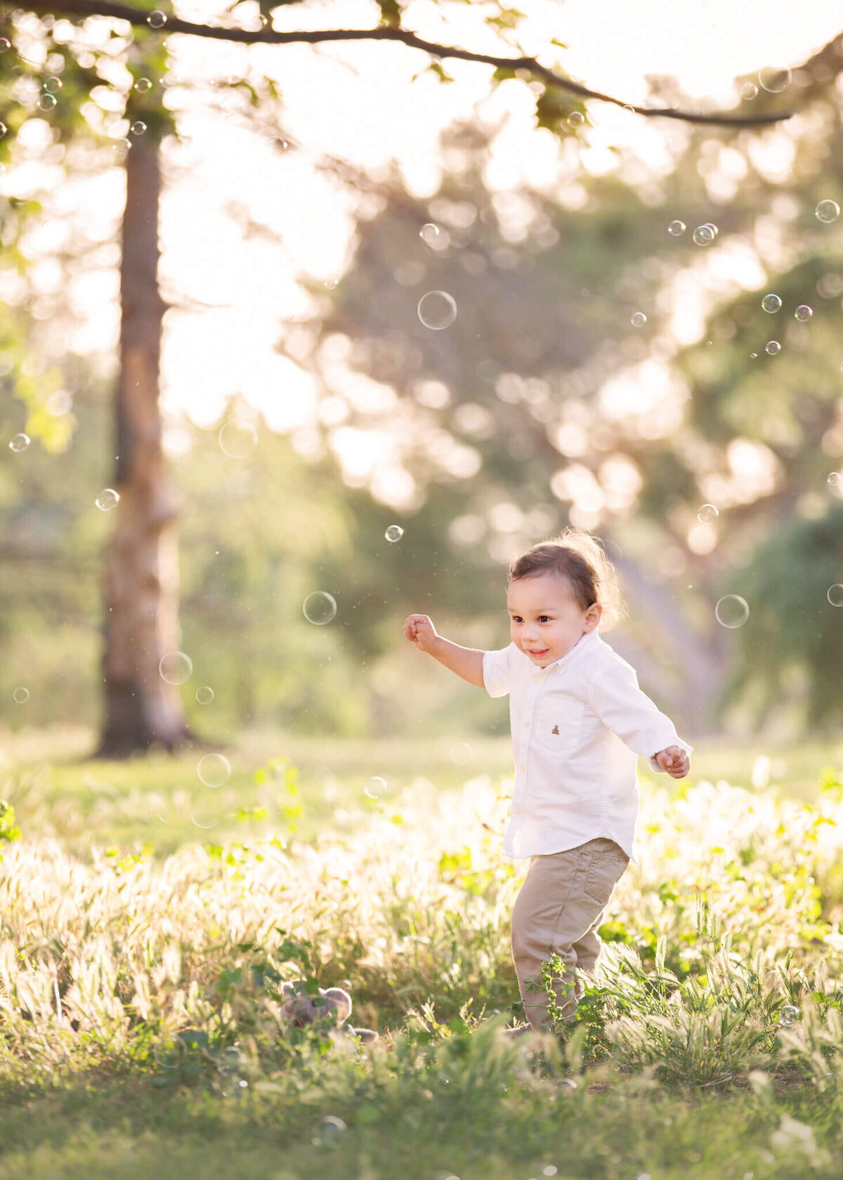 Little boy running through the park laughing - Los Angeles Children’s Photographer