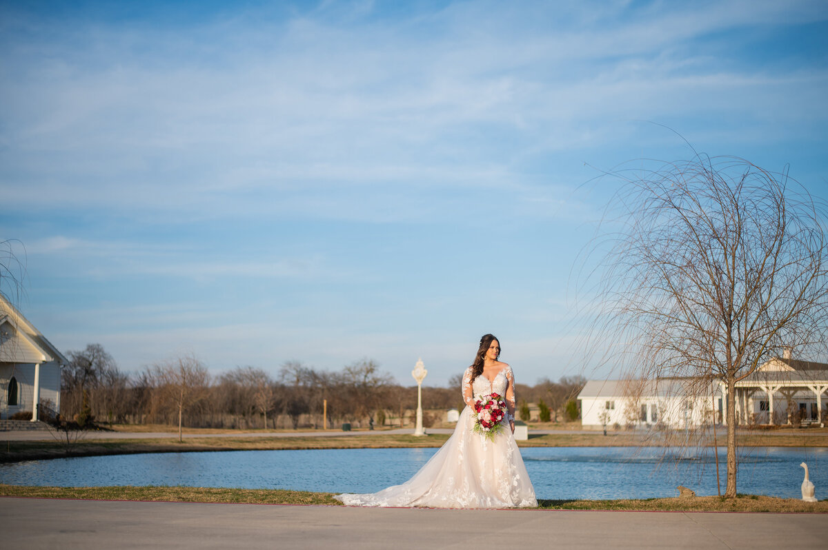 bride by pond at One Preston Event Venue