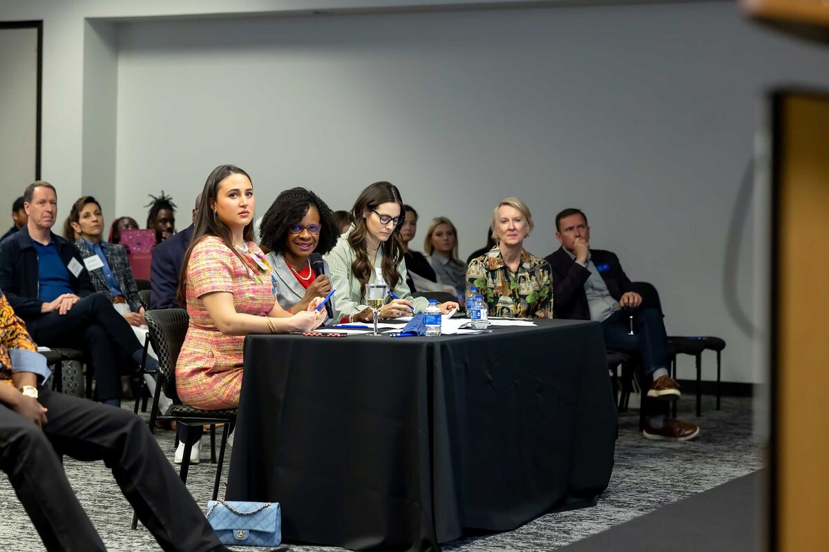 Professional event photographer in Dallas, TX capturing a memorable corporate event, photographed by Sophie K. Hunter.