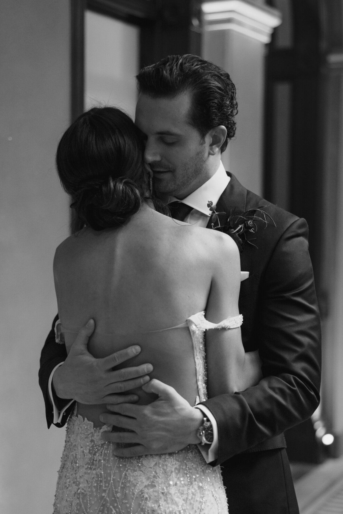 Bride and groom embrace