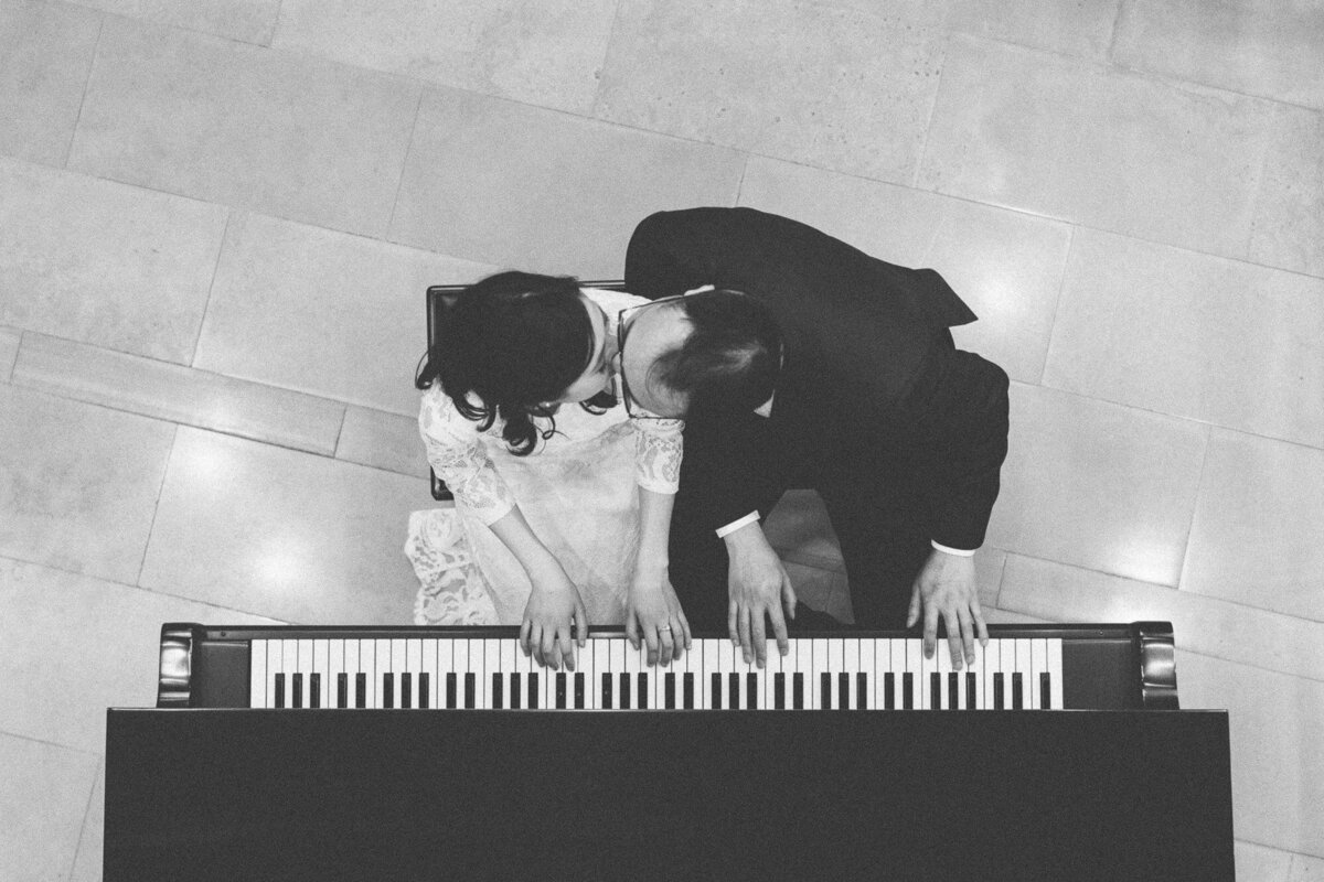 couple playing piano together