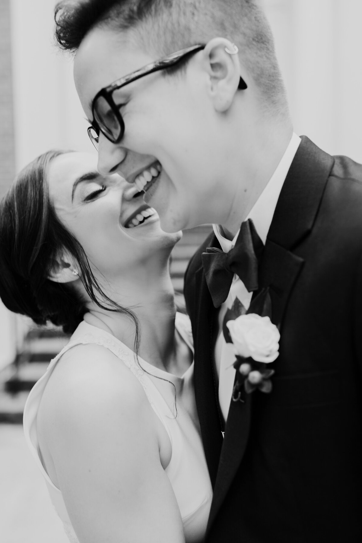A sweet close up candid of an LGBTQ+ couple captured by Fort Worth Wedding Photographer, Megan Christine Studio