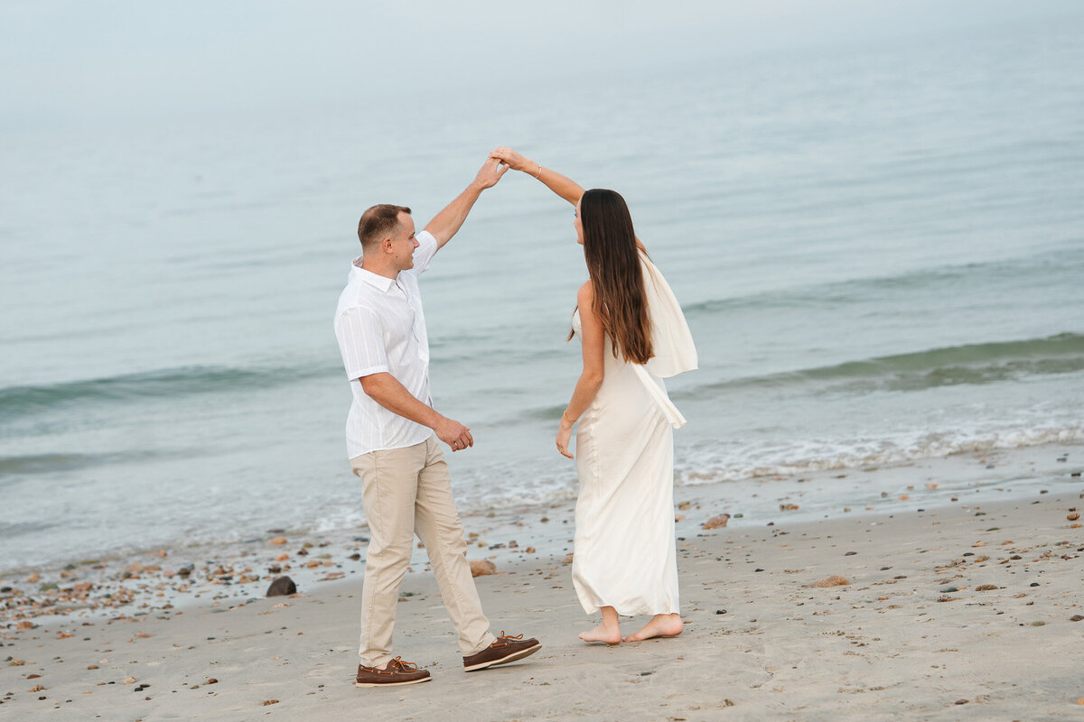 Romantic coastal engagement session in New England overlooking the shoreline.