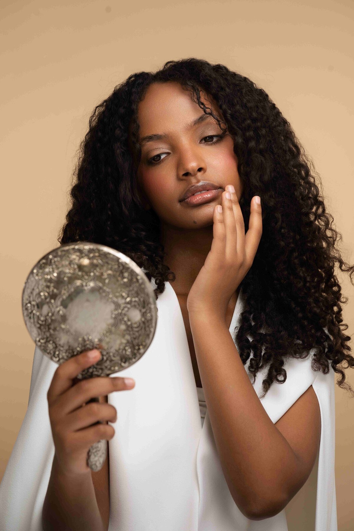 model posing with mirror