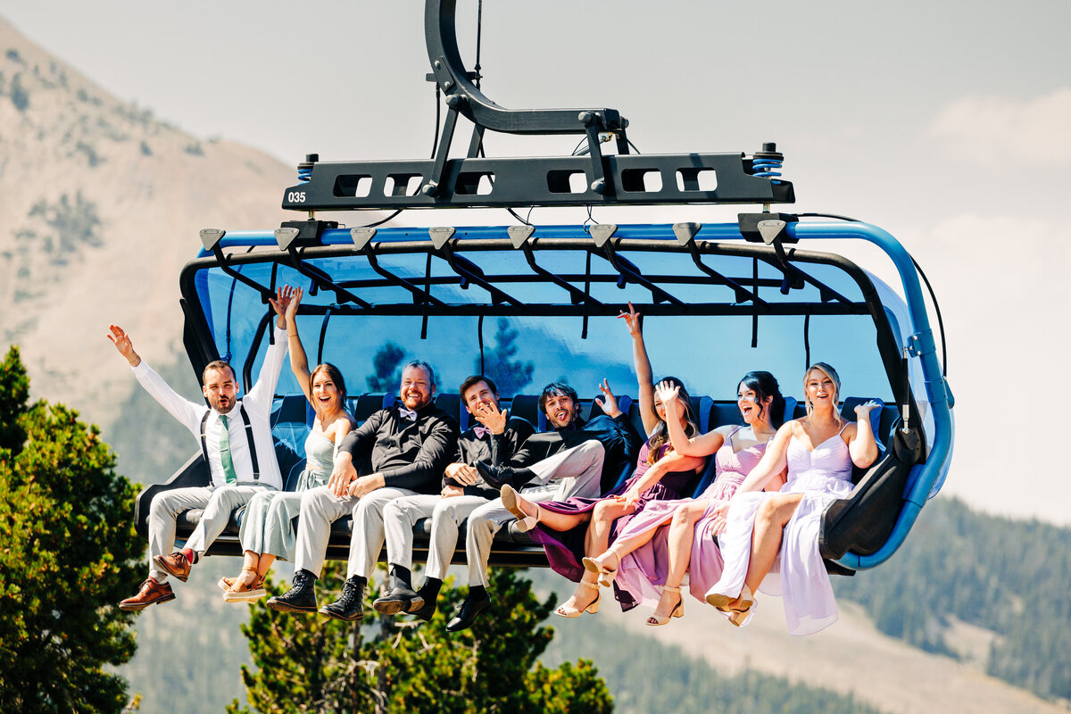 Bridal party riding the Ramcharger 8 chair lift at Big Sky Resort, Montana