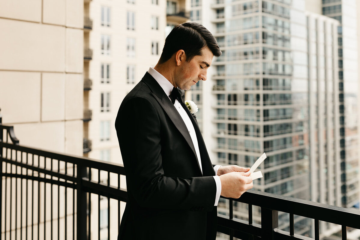 Groom reading letter from bride