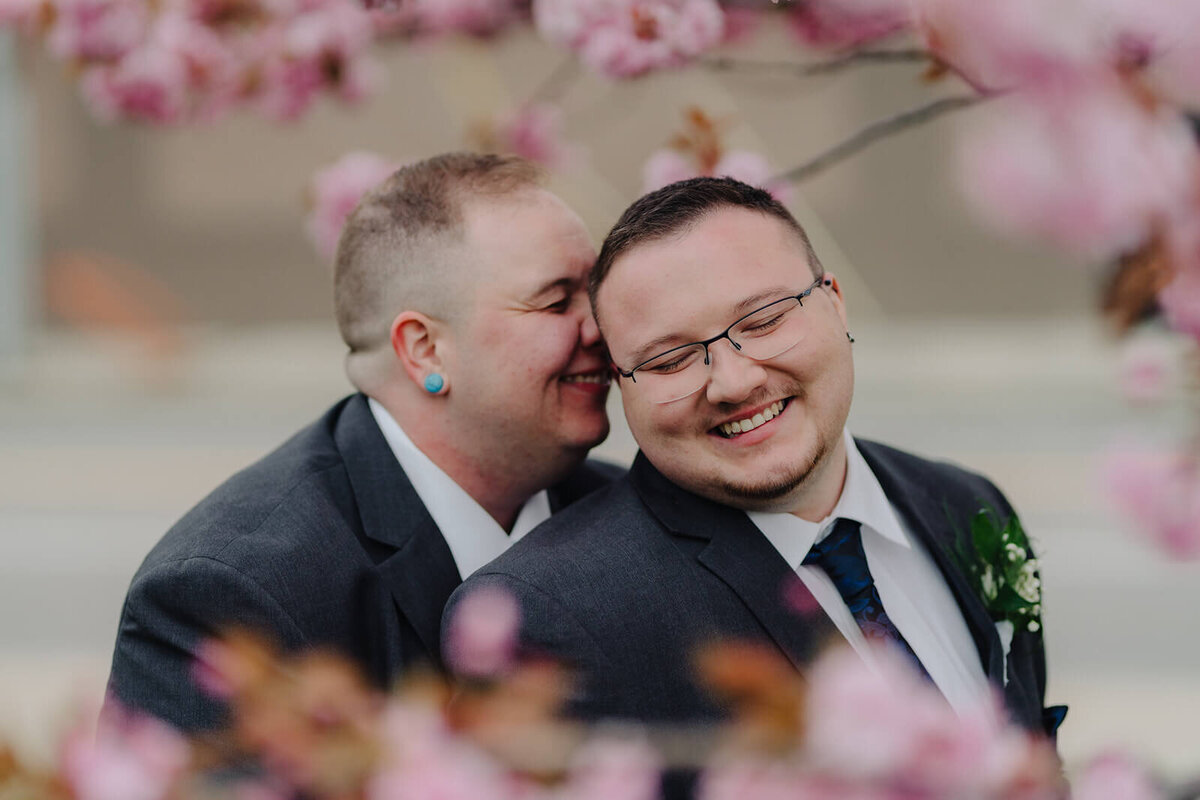 Gay couple amongst the cherry blossom in Rochester NY