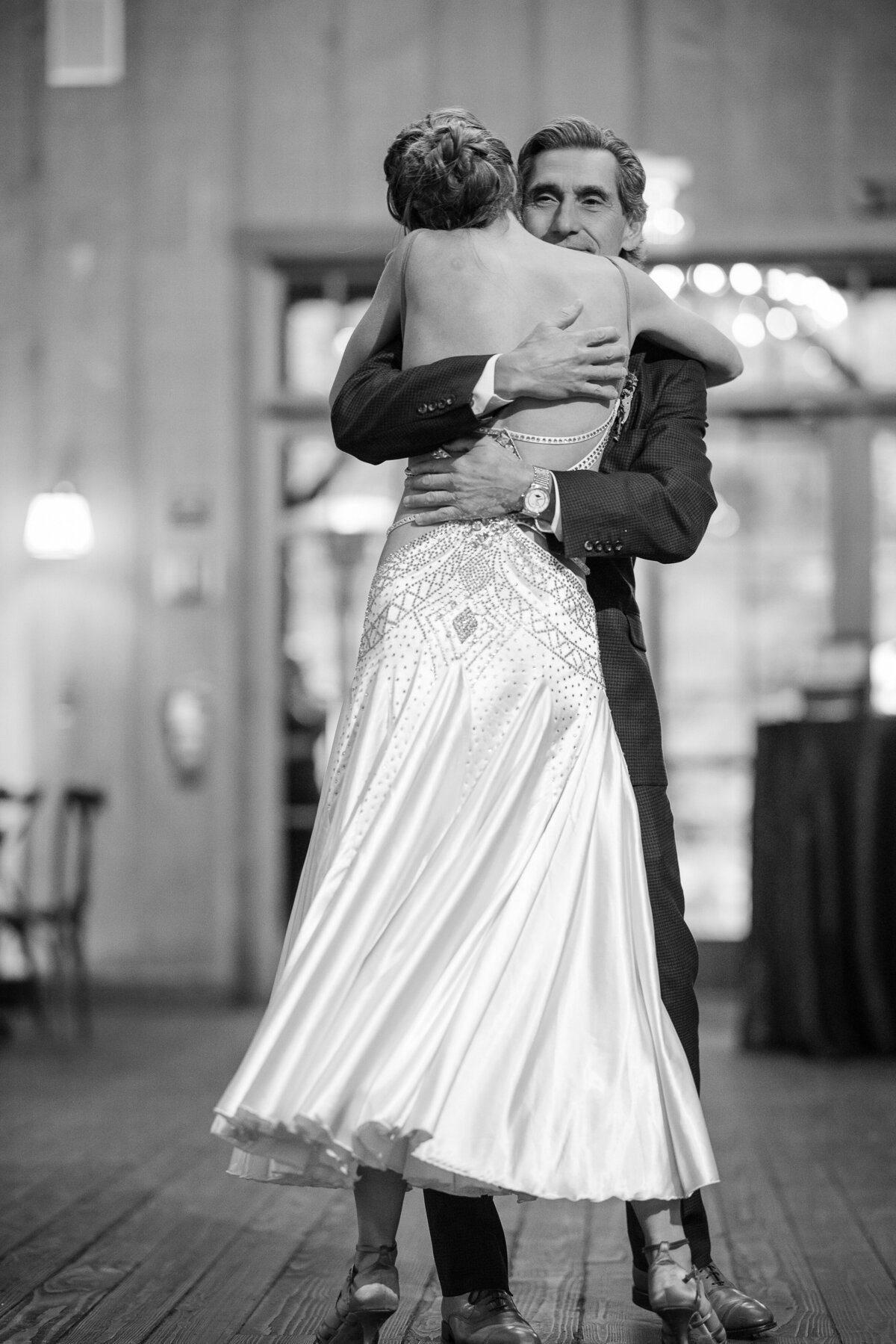 A couple dances at their reception at a destination wedding at Nestldown in Los Gatos, California