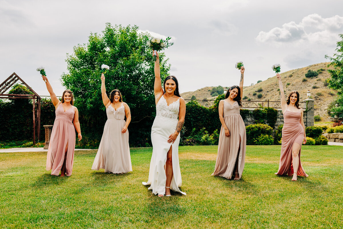 Bride and bridesmaids walking together at Chancey's Event Center in Huntley, MT
