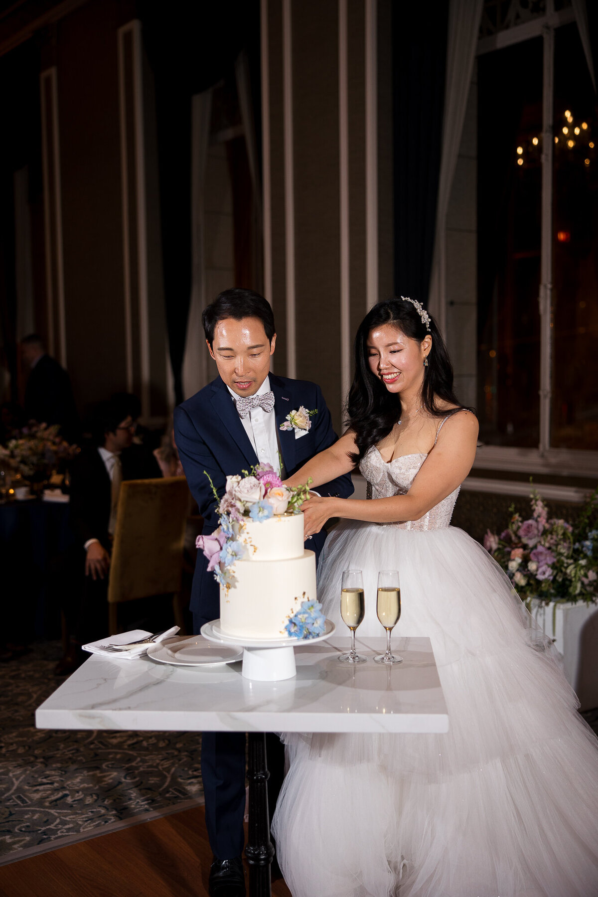 Wedding cake cutting Beacon Grand San Francisco Bay Area luxury wedding photographer