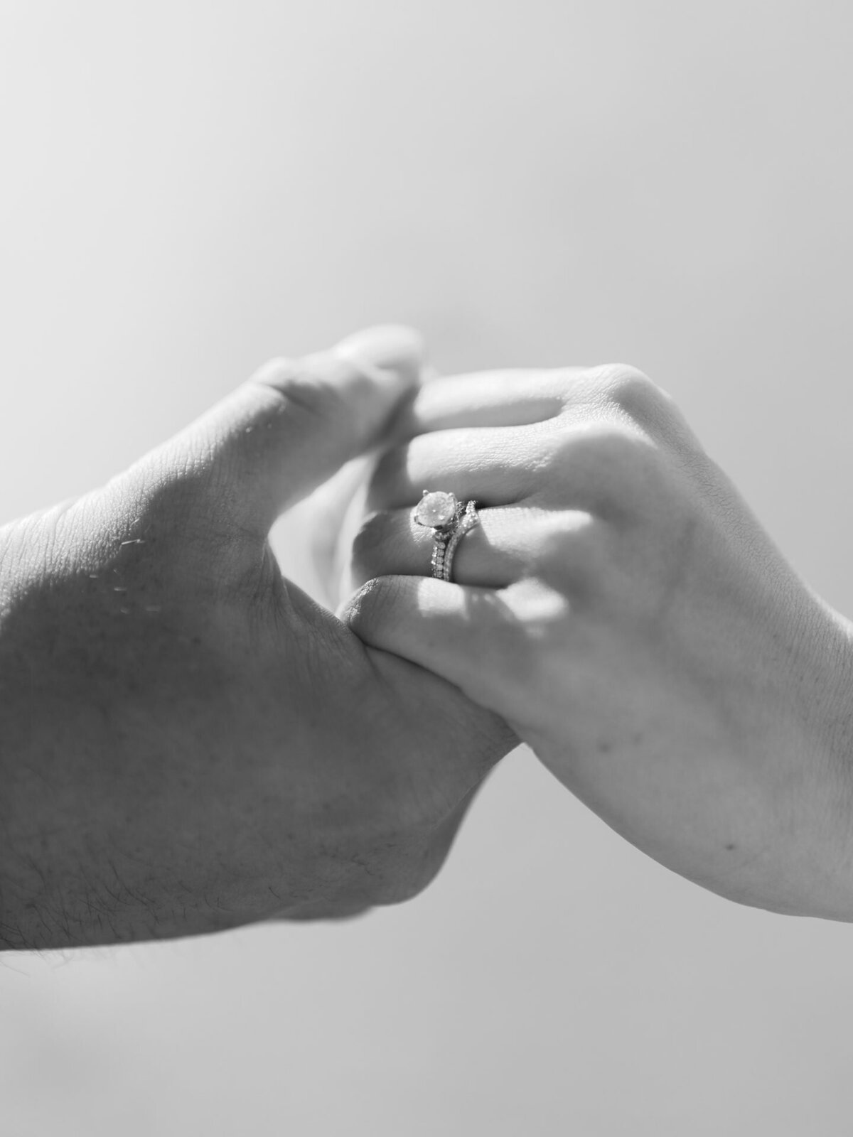Engagement ring and wedding band featured at San Diego beach photoshoot