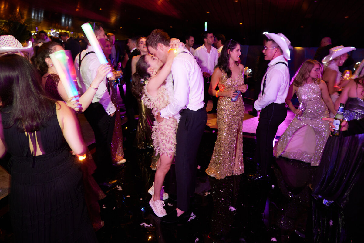 bride and groom kissing on dancefloor