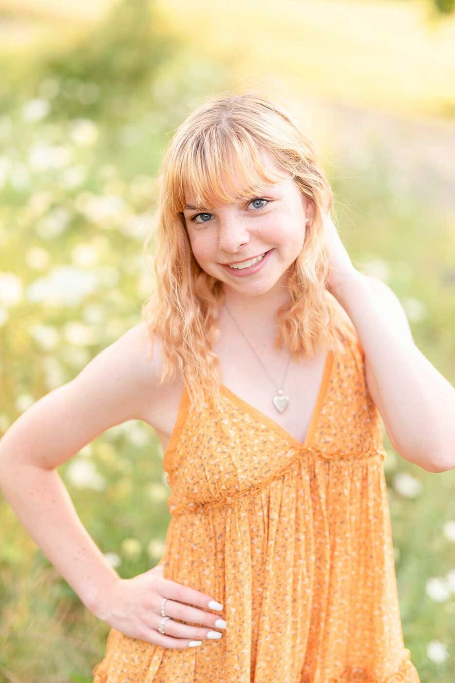 Girl-in-orange-dress-and-flower-field