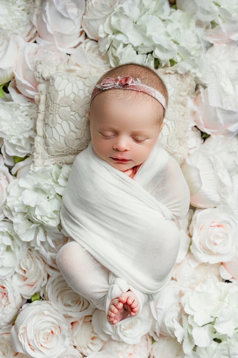 Newborn baby swaddled and sleeping for photos with nj photographers Ally Kimpton Photography