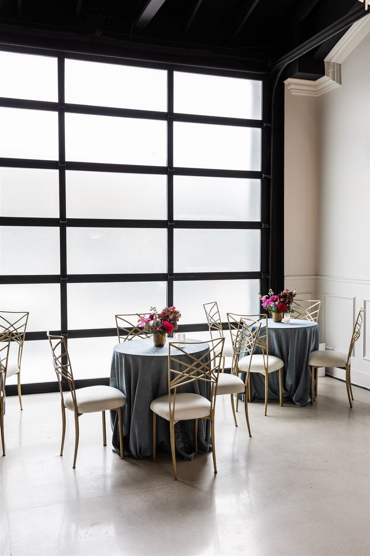 Event space styled with a Baroque theme, featuring ornate gold accents, rich fabrics, grand chandeliers, and intricate moldings, creating a luxurious and dramatic atmosphere