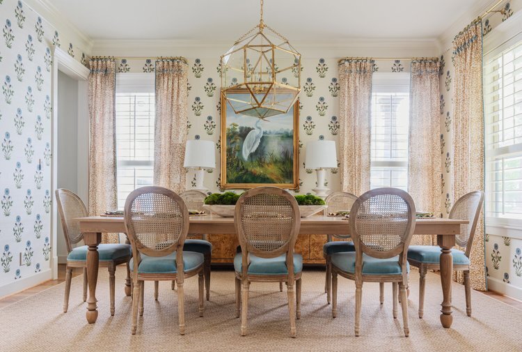 oyster creek studios oak forest remodel wooden kitchen chairs with turquoise cushions in dining room with heron painting