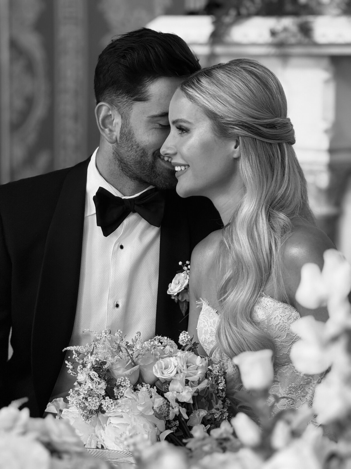 Bride and groom smiling at Soughton Hall