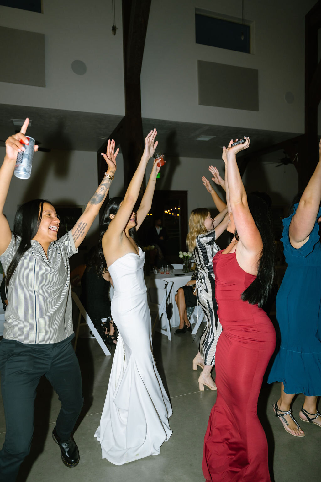 Bride and guests dancing at the reception