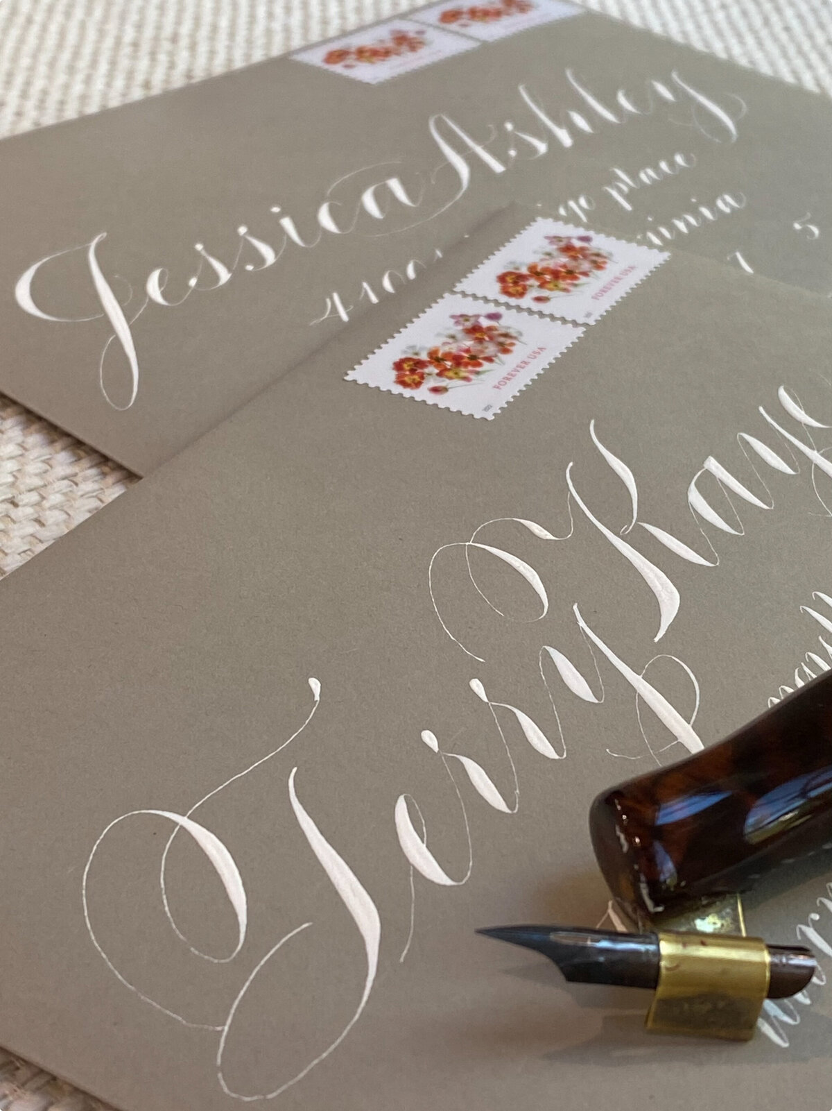 Custom calligraphy in an envelope with stamps