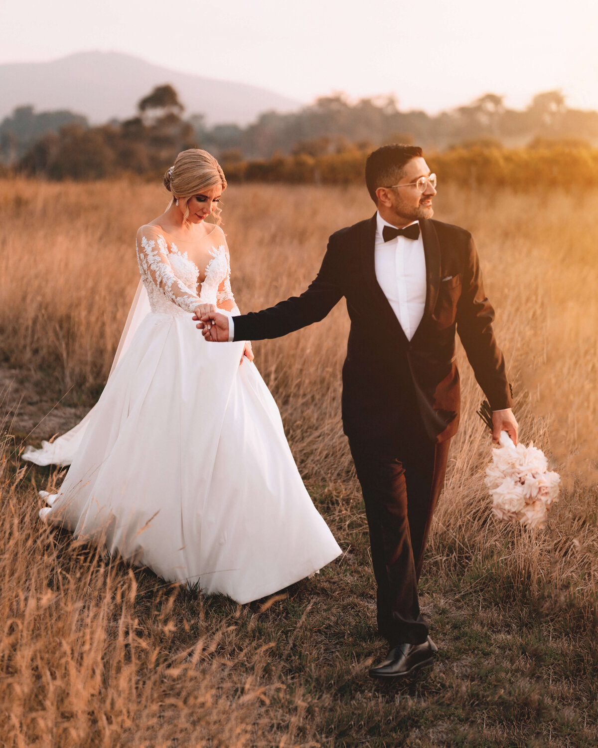 Bride and Groom walking at Sunset
