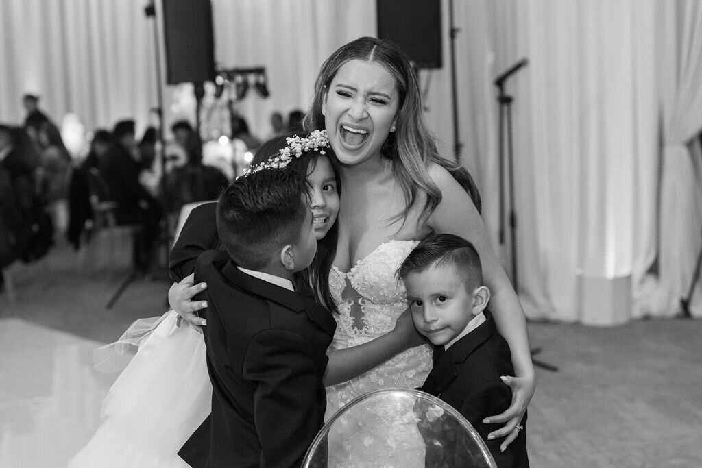 Bride laughing with her nephews