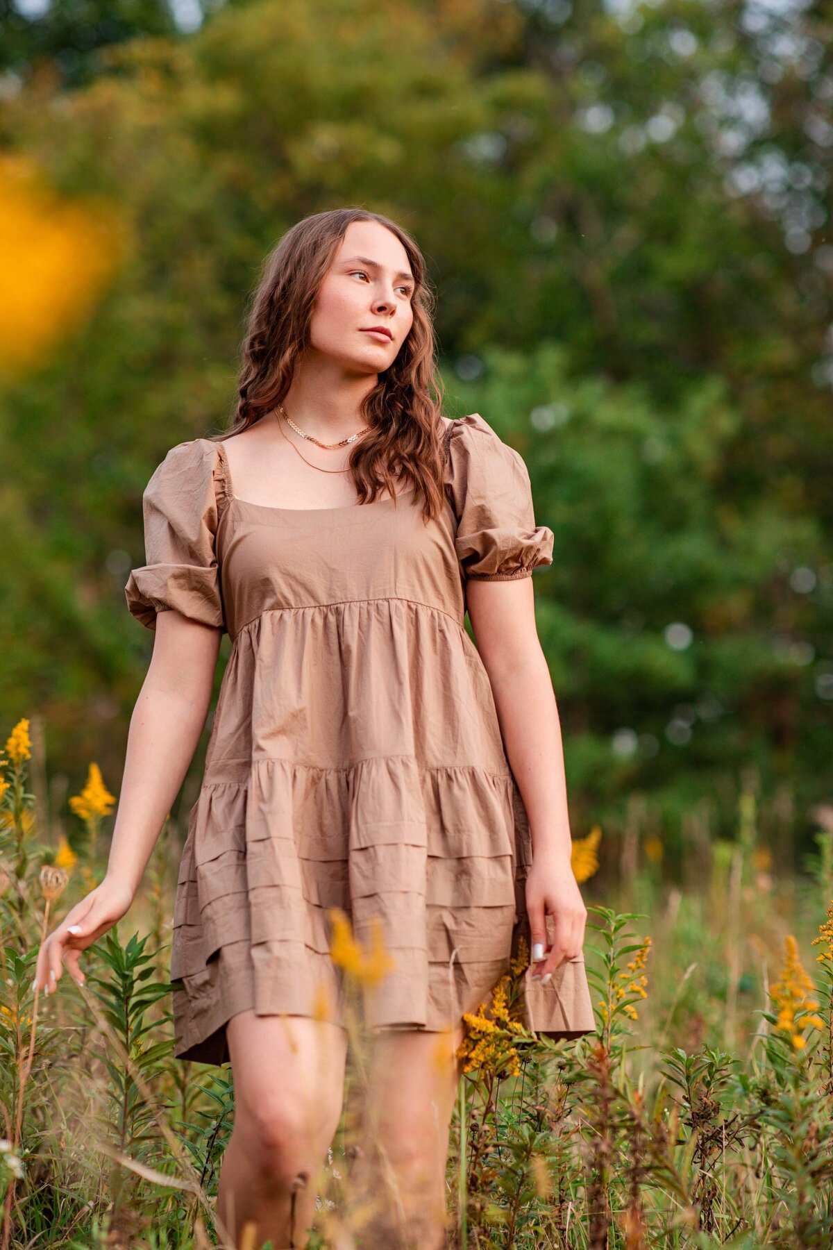 apple-river-illinois-high-school-senior-girl-walking-in-field