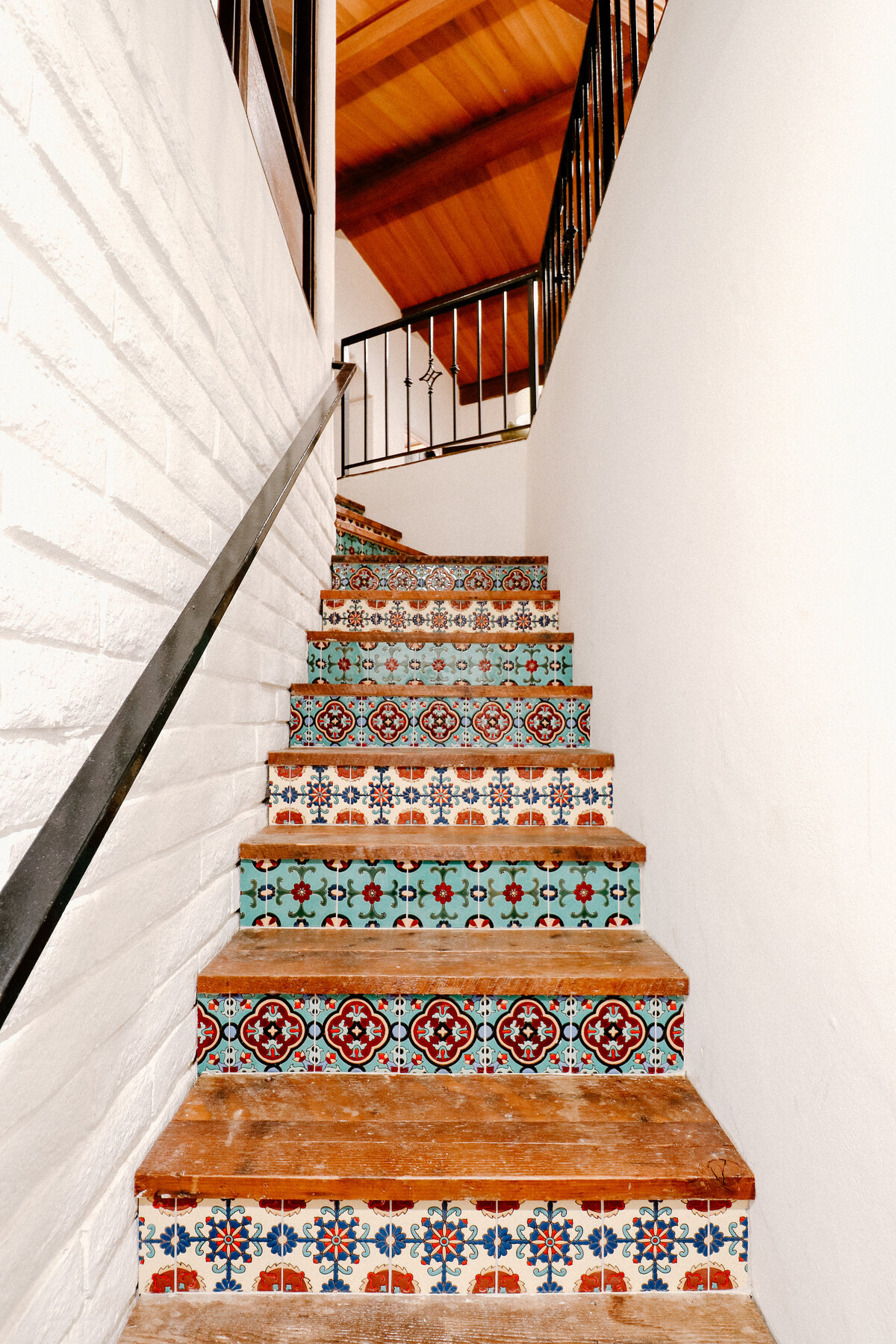 multi color tiles on custom stairs