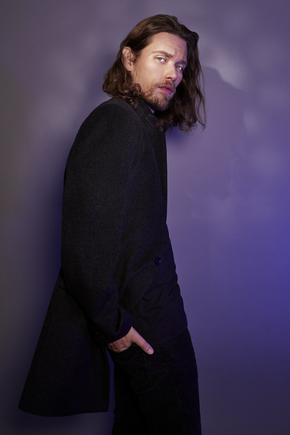 Cameron Cowperthwaite in a bold, expressive portrait, emphasizing his dynamic presence, shot by Ylva Erevall.