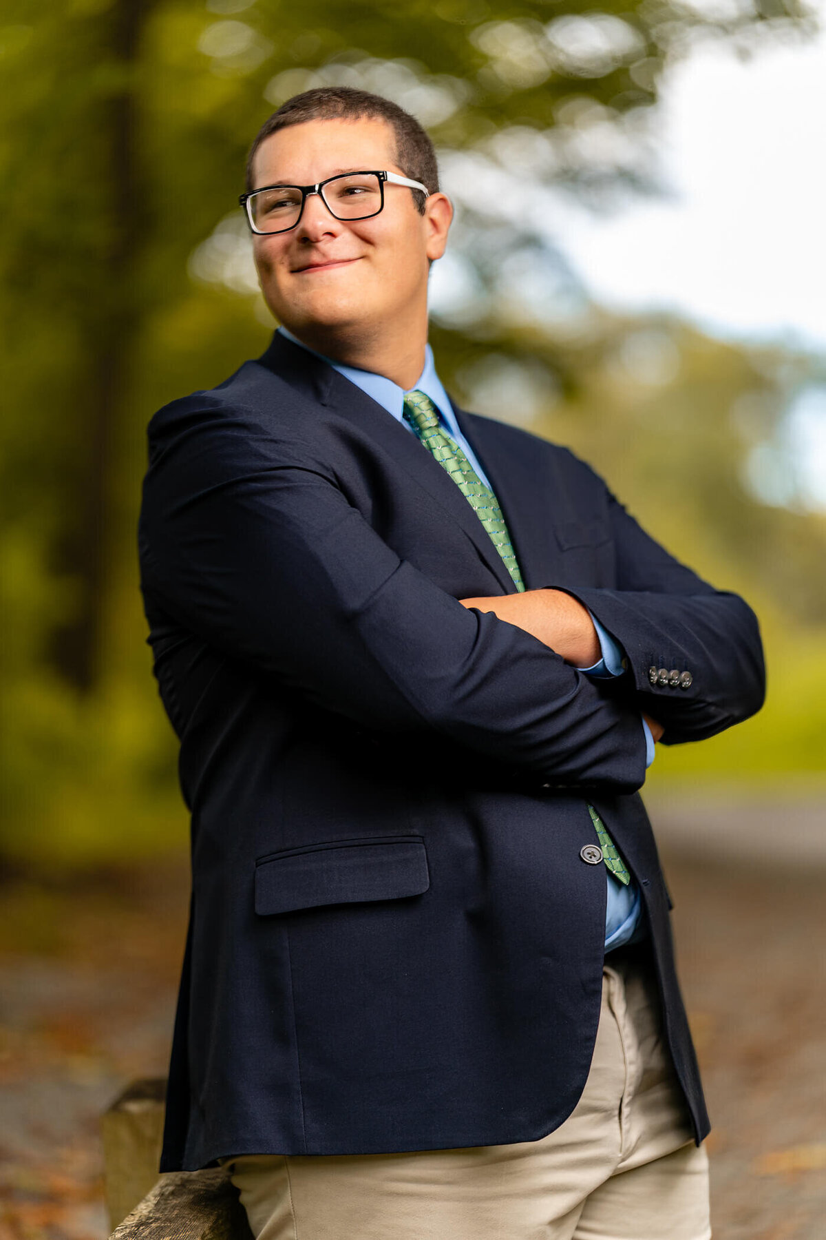 Portrait of a senior grad smiling off camera at McConnell's mill state park