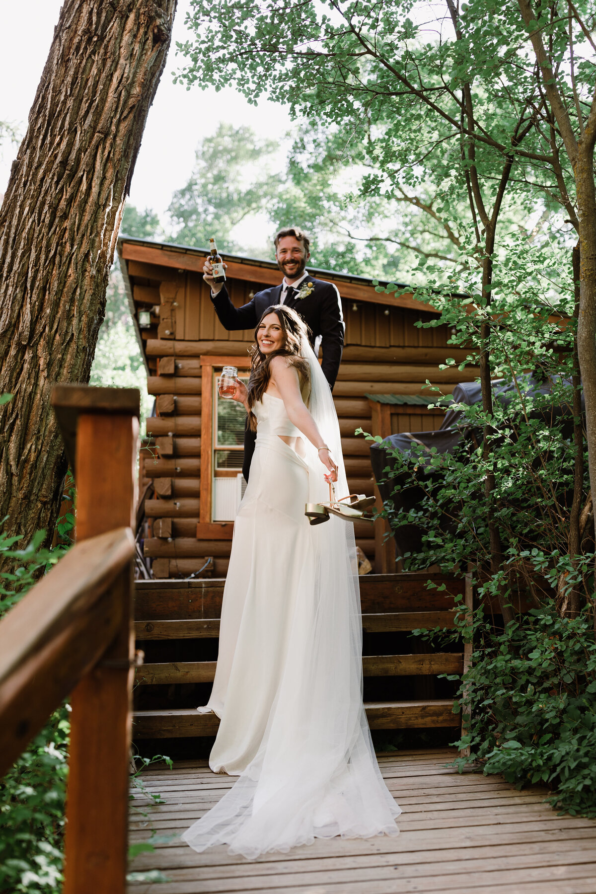 Bride and groom outside a cabin at Dallenbach Ranch Colorado Wedding