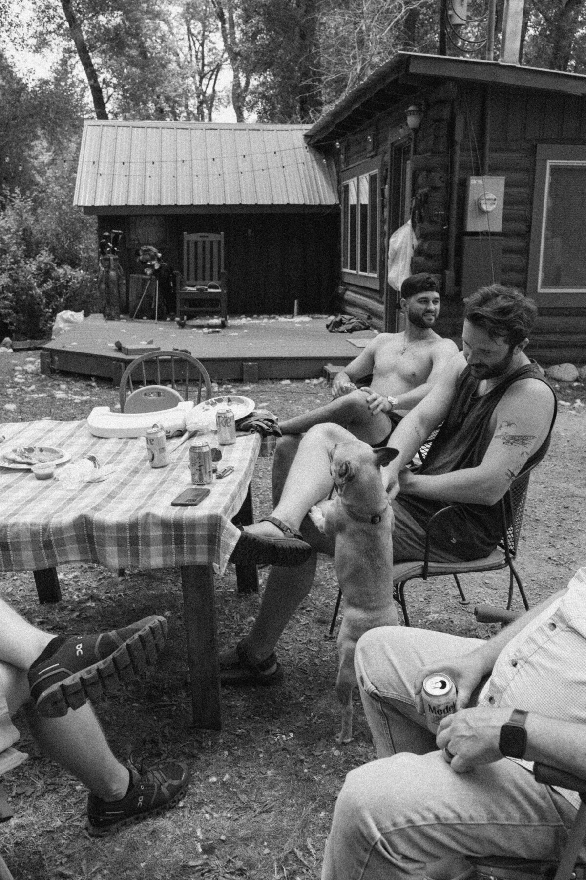 Groomsmen sitting around and drinking before Dallenbach Ranch Colorado Wedding