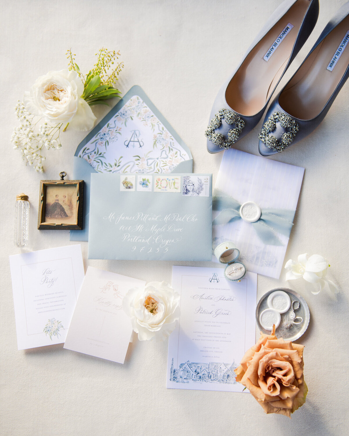 dusty blue wedding invitation with blue manolo blahnik bridal shoes