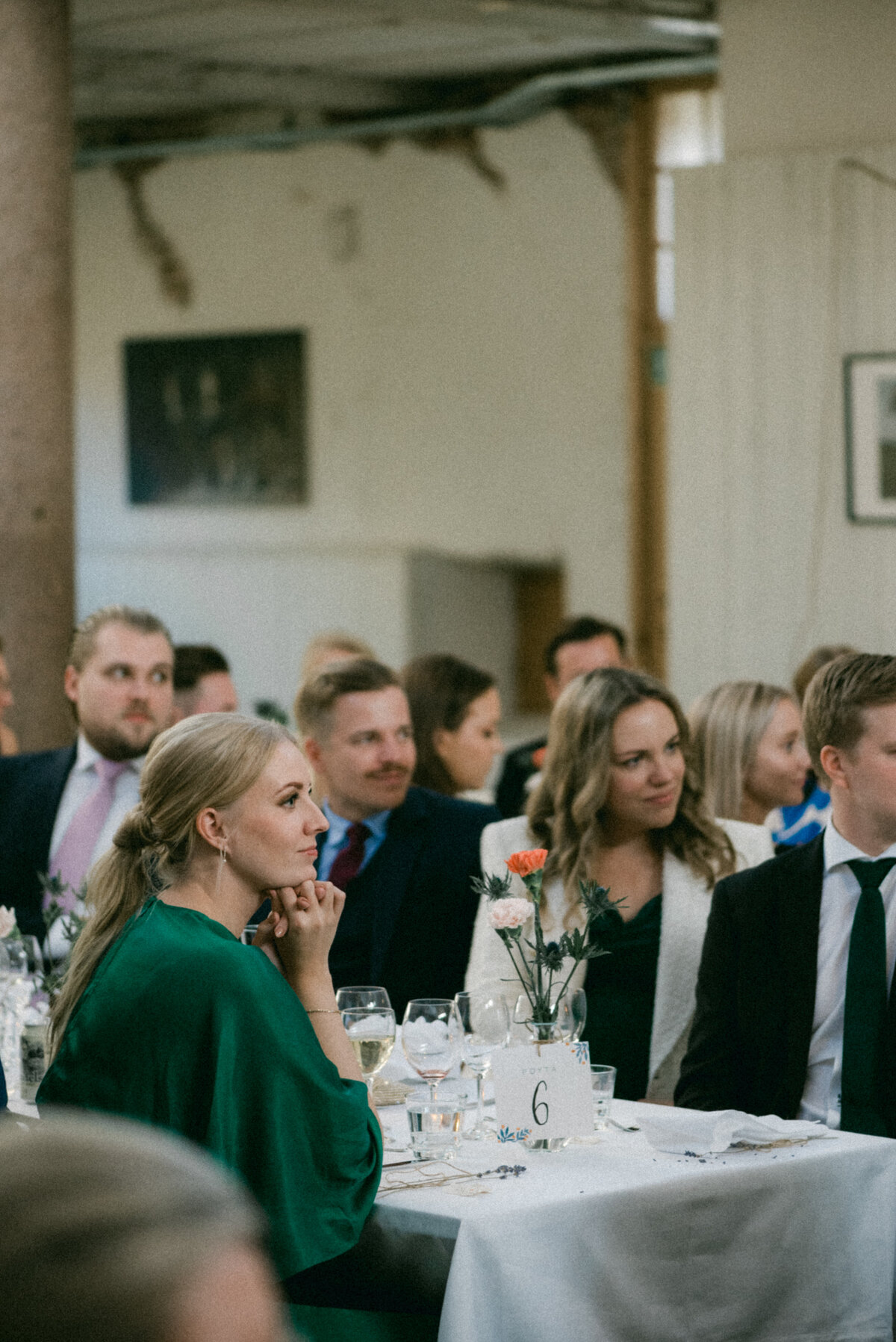 A documentary wedding  photo of guest in a wedding reception in Oitbacka gård captured by wedding photographer Hannika Gabrielsson in Finland