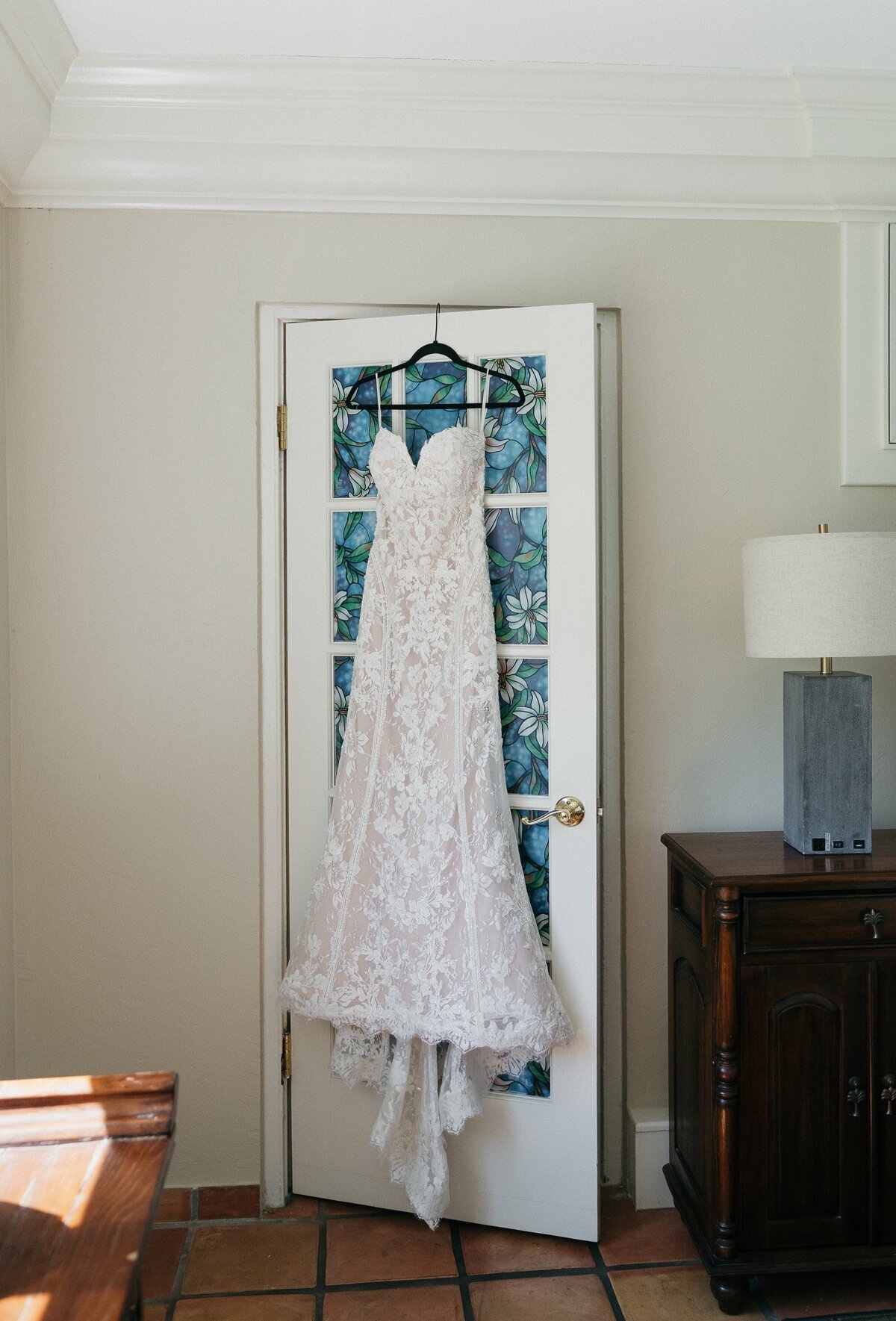 Bride's dress hanging by film wedding photographers, Shelby Ann Photos