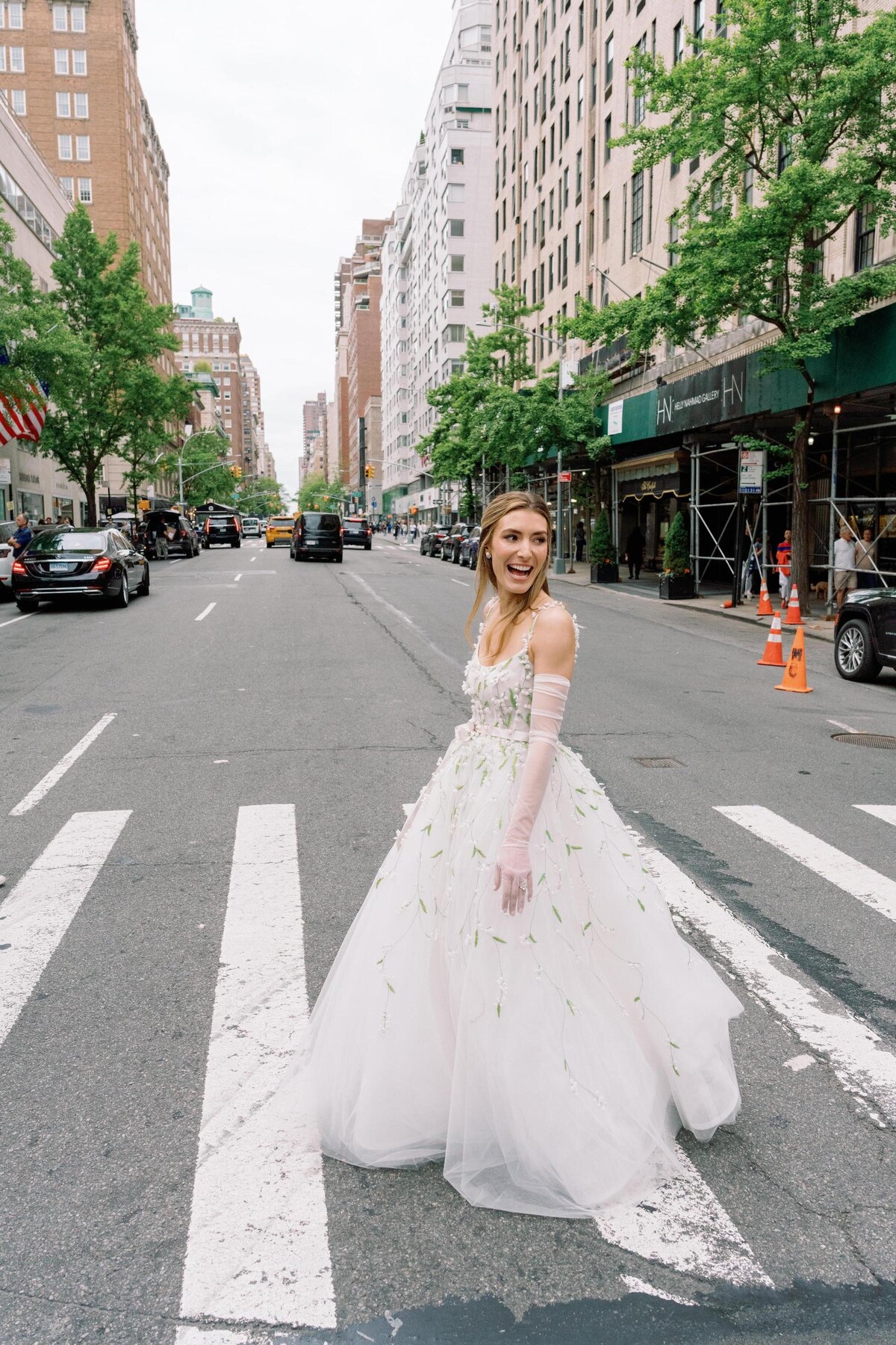 erica-renee-beauty-hair-and-makeup-duo-traveling-team-NYC-bride-street-shot-crosswalk-carlyle-hotel-NYC-over-the-moon-bride