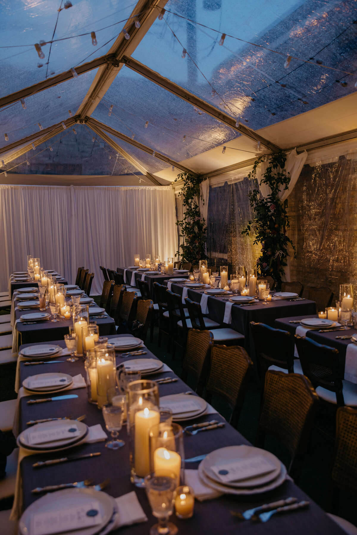 Dimly lit tent dinner set up at Ada Street Restaurant