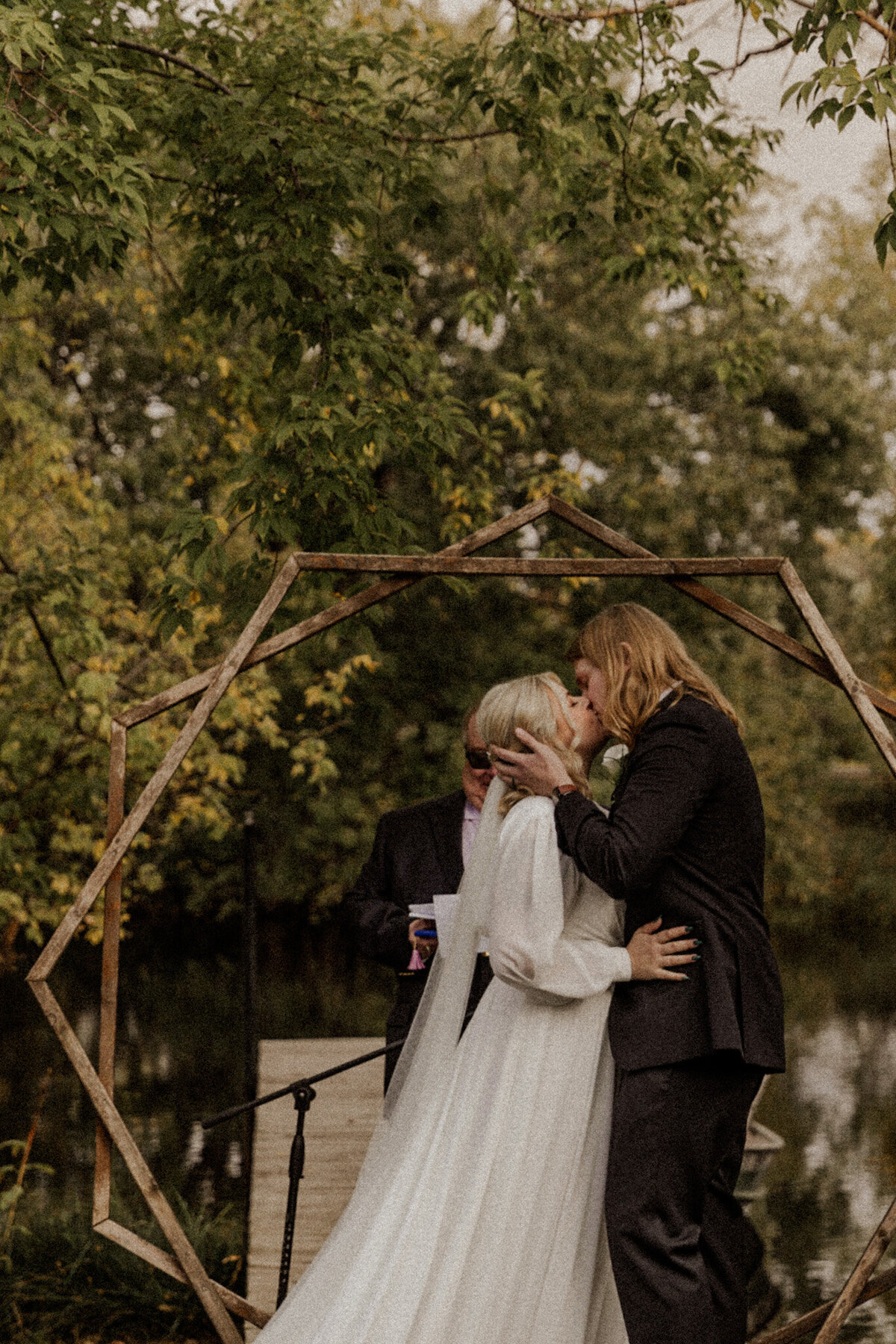 Bride and Groom Kissing During Wedding cermeony in Woodbury, MN 