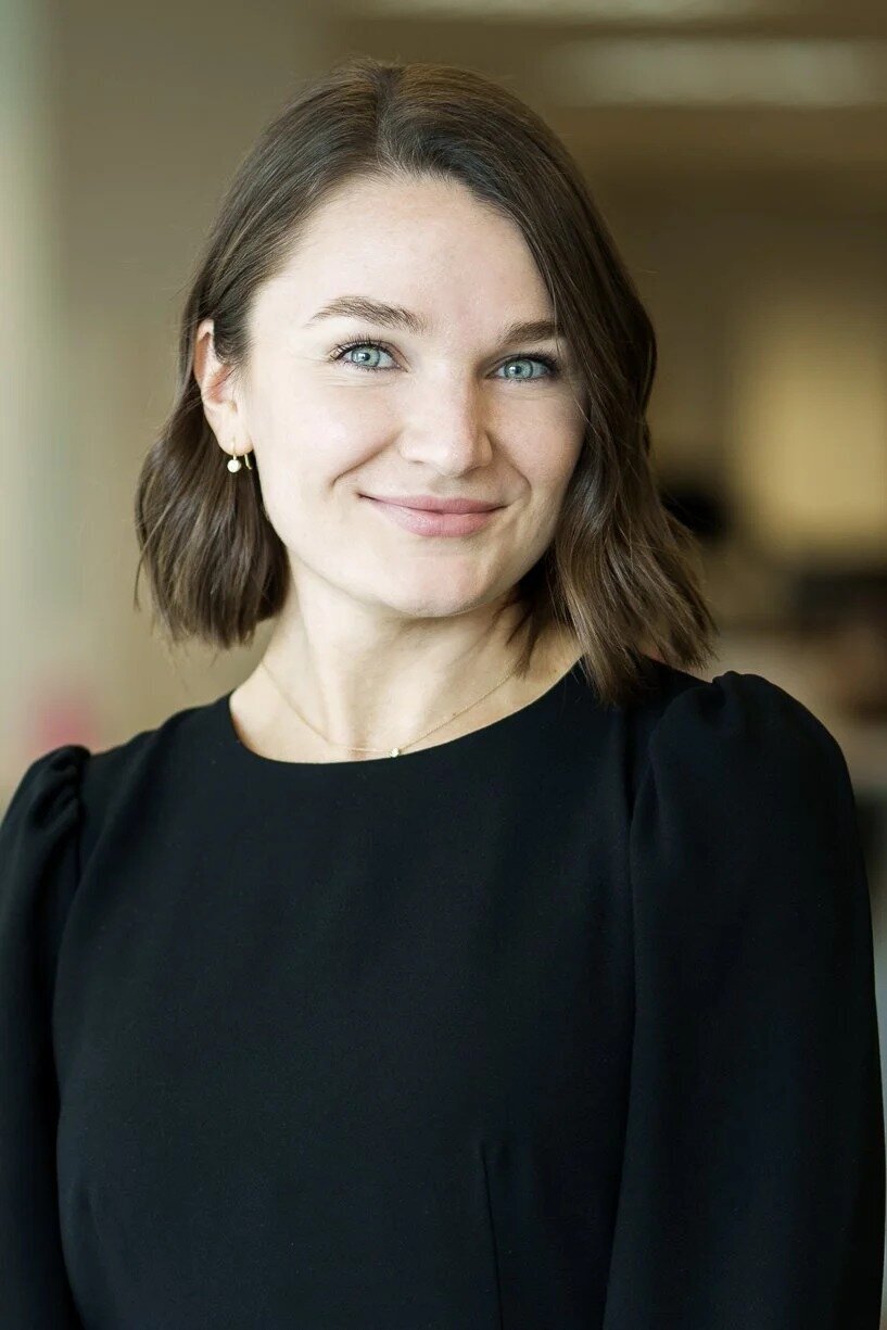 Professional headshot of confident woman in NJ studio with natural smile