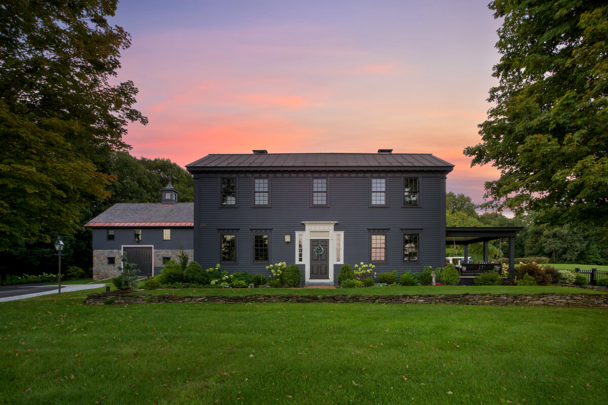 front exterior view of dark gray house