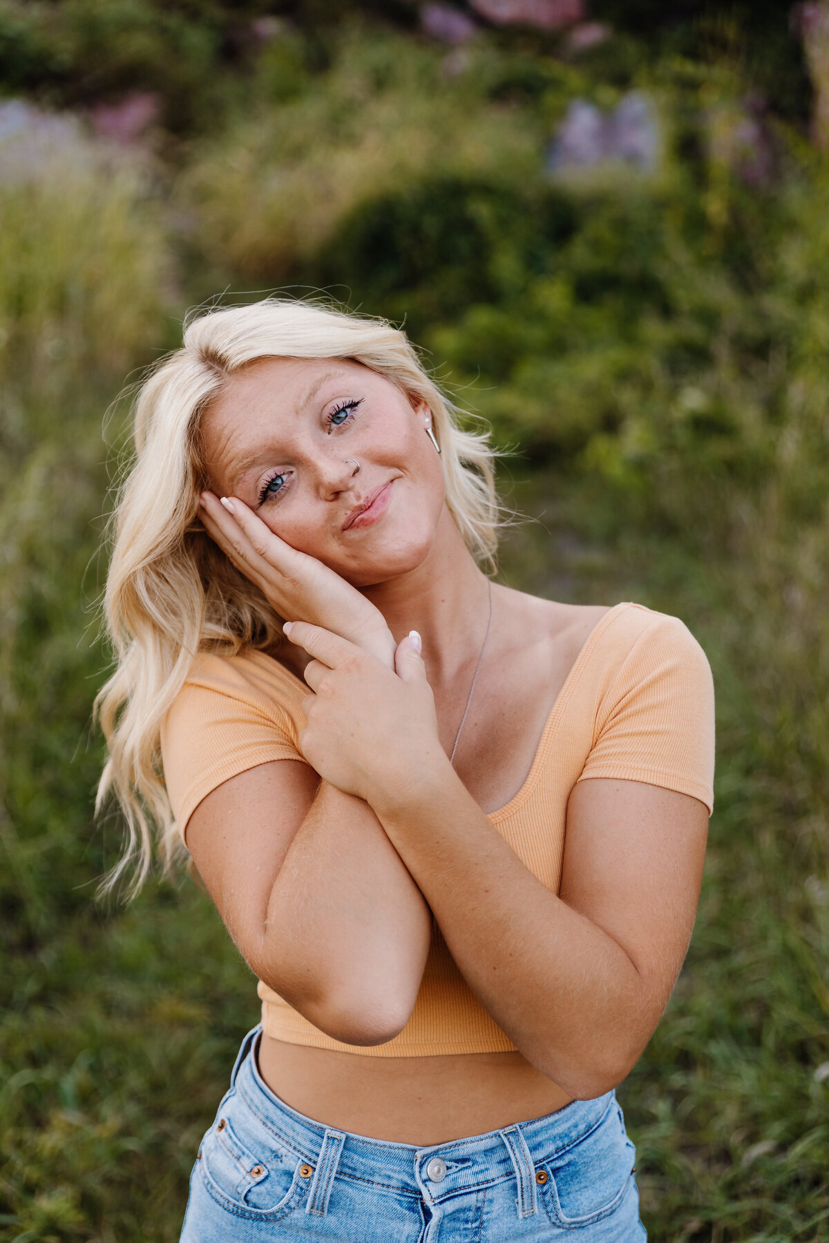 A girl with her head laid in her palm