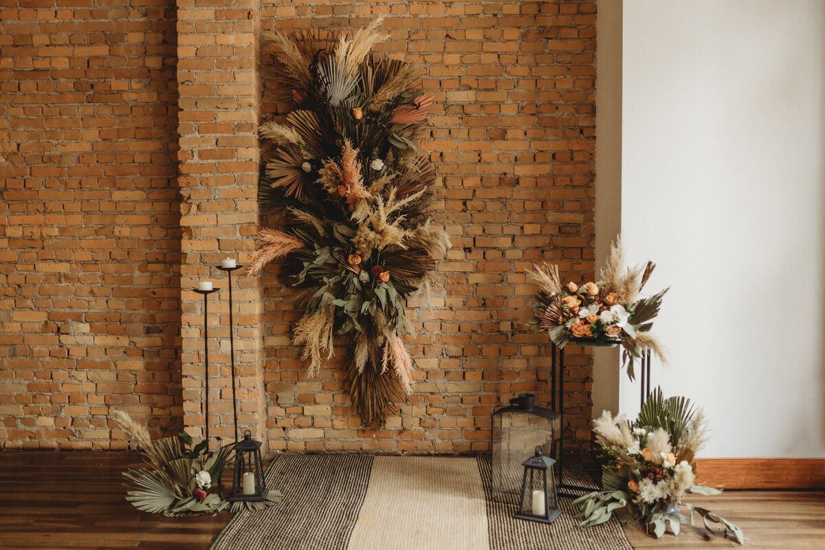 Elegant boho inspired indoor wedding ceremony at The Garret, historical and sophisticated, Calgary, Alberta wedding venue, featured on the Brontë Bride Vendor Guide.