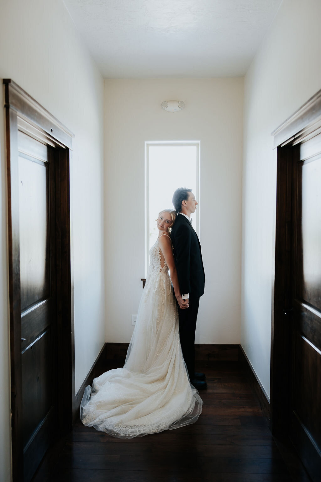 Couple's first look in a hallway