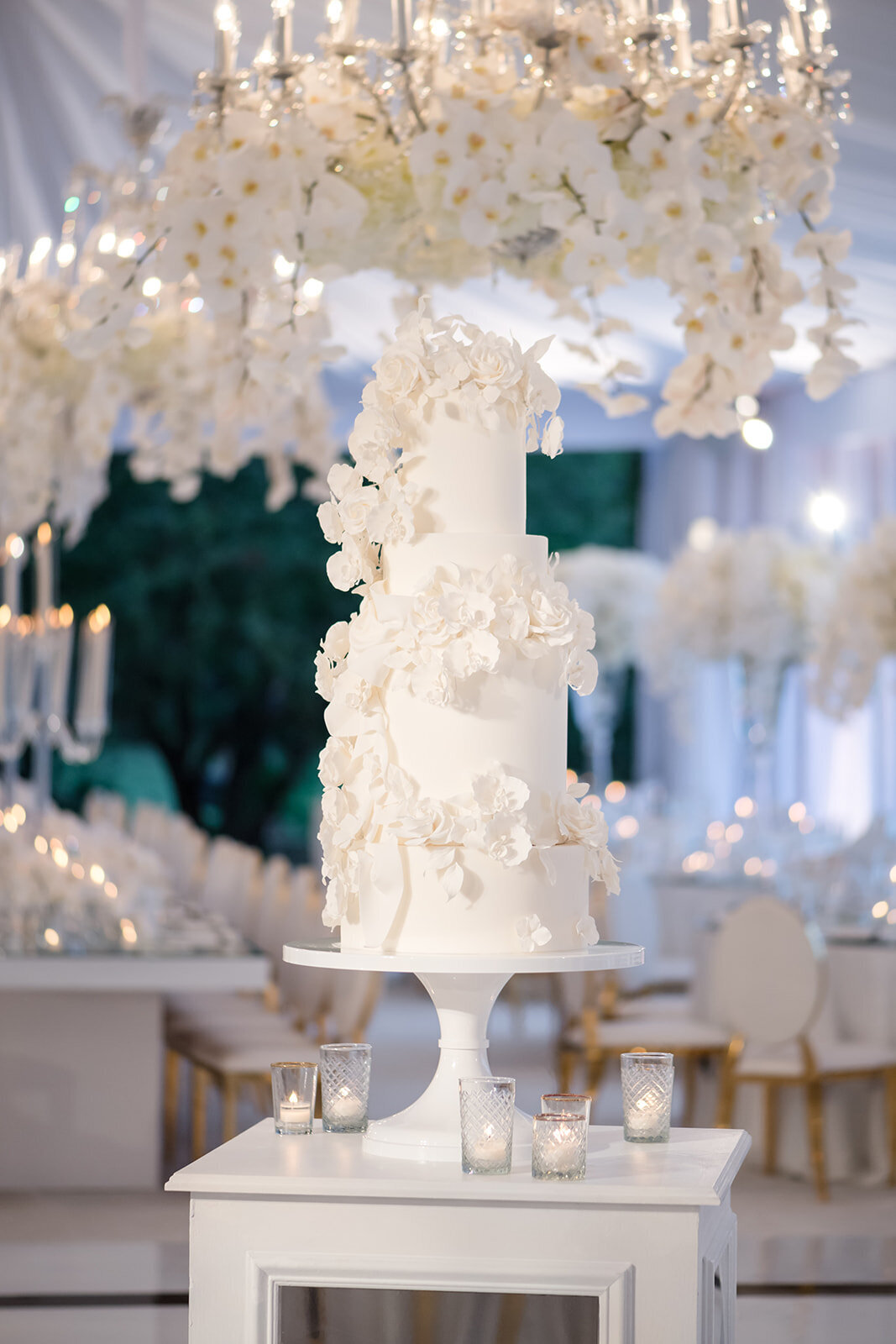 Detailed shot of a tall floral centerpiece at the reception.