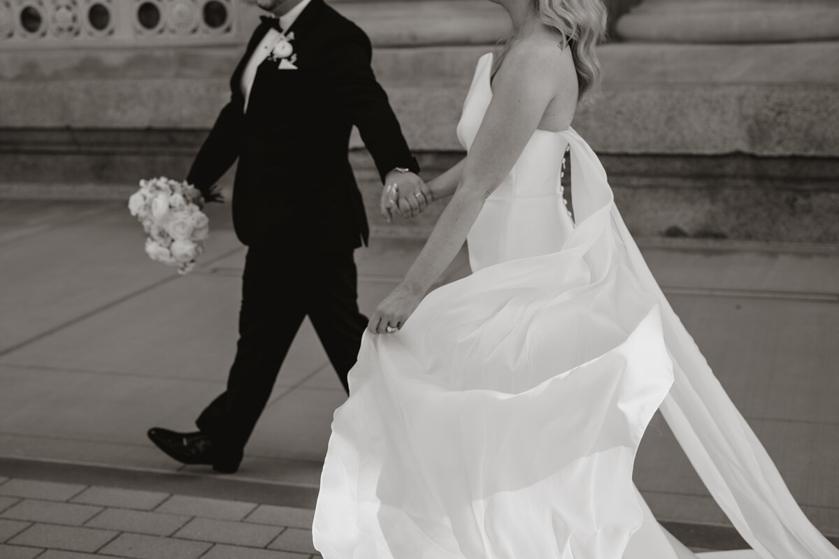 bride and groom smiling and embracing one another