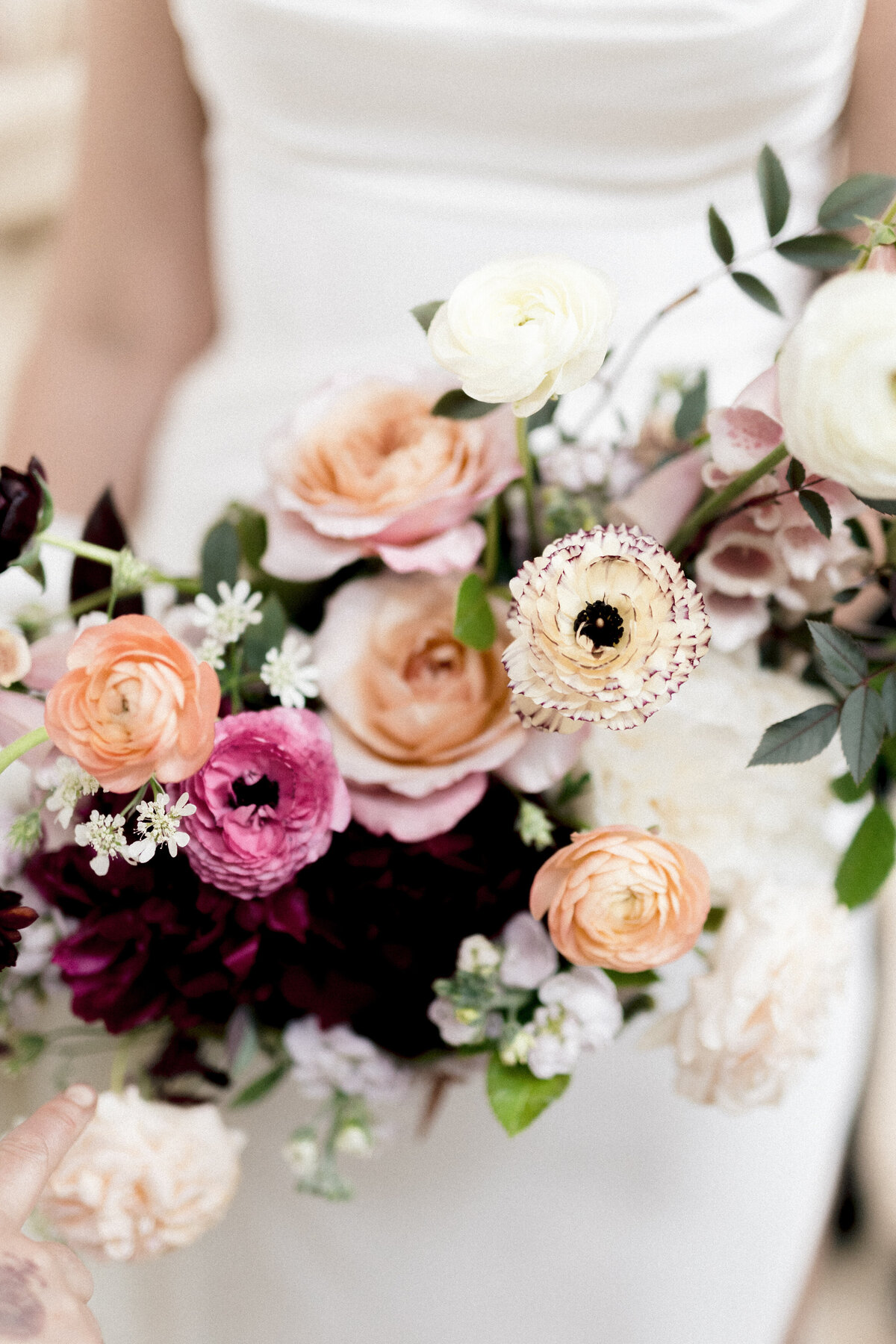 Close-up of a pink and purple pastel bridal bouquet at a Montreal wedding. 