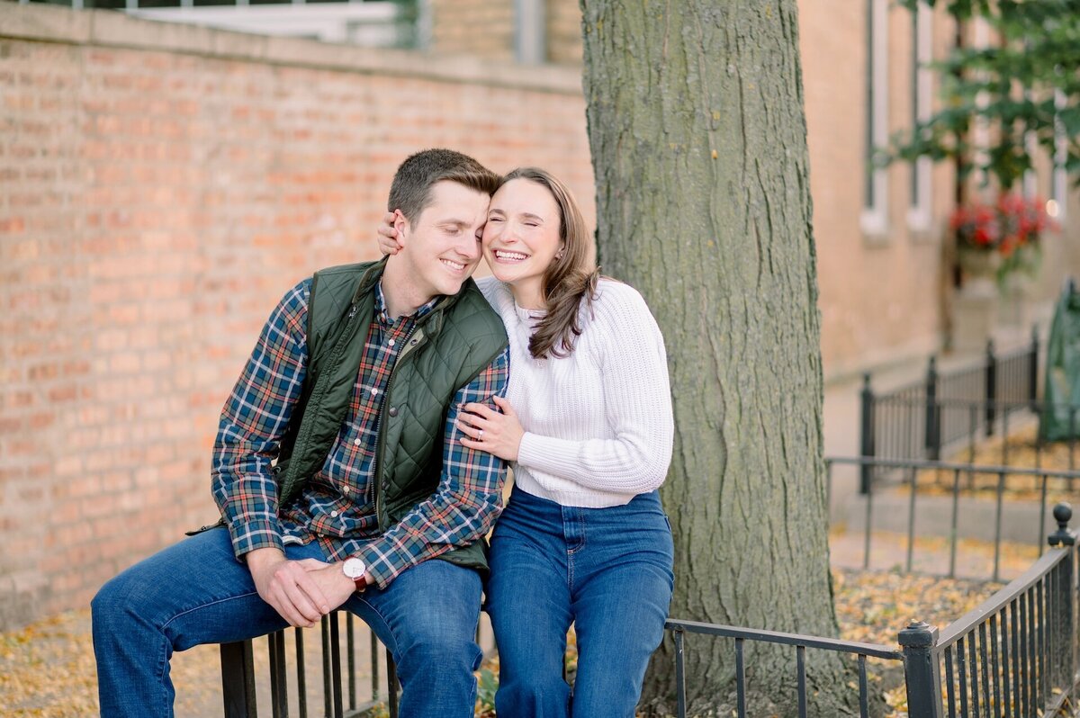 couple sitting on a fence in Downtown Chicago