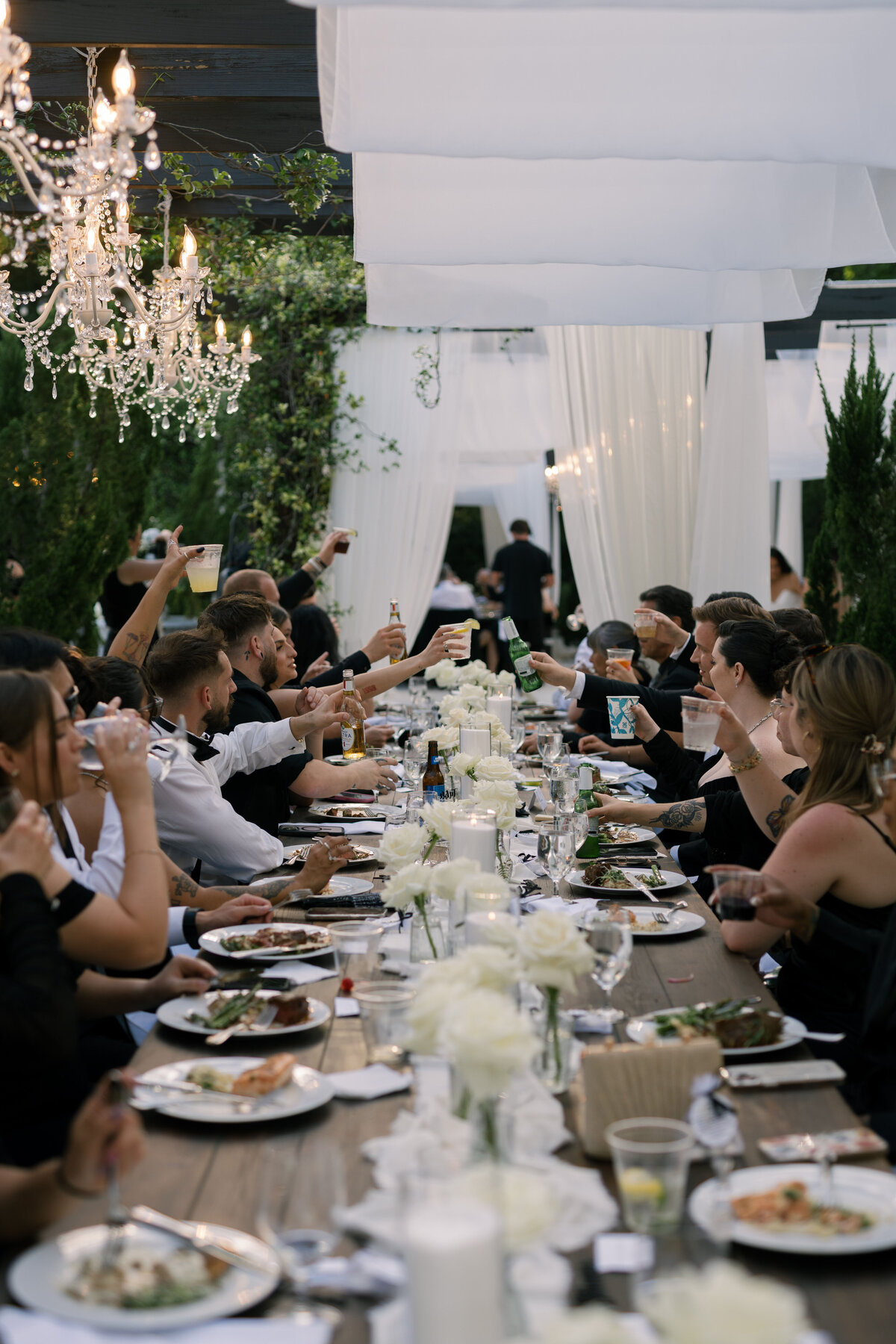 guests cheering during dinner at La Casa Toscana Wedding Venue Fort Myers Florida