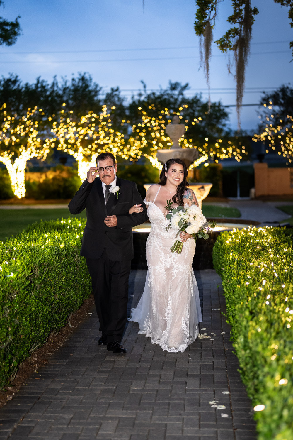 Bride and father walk down the aisle