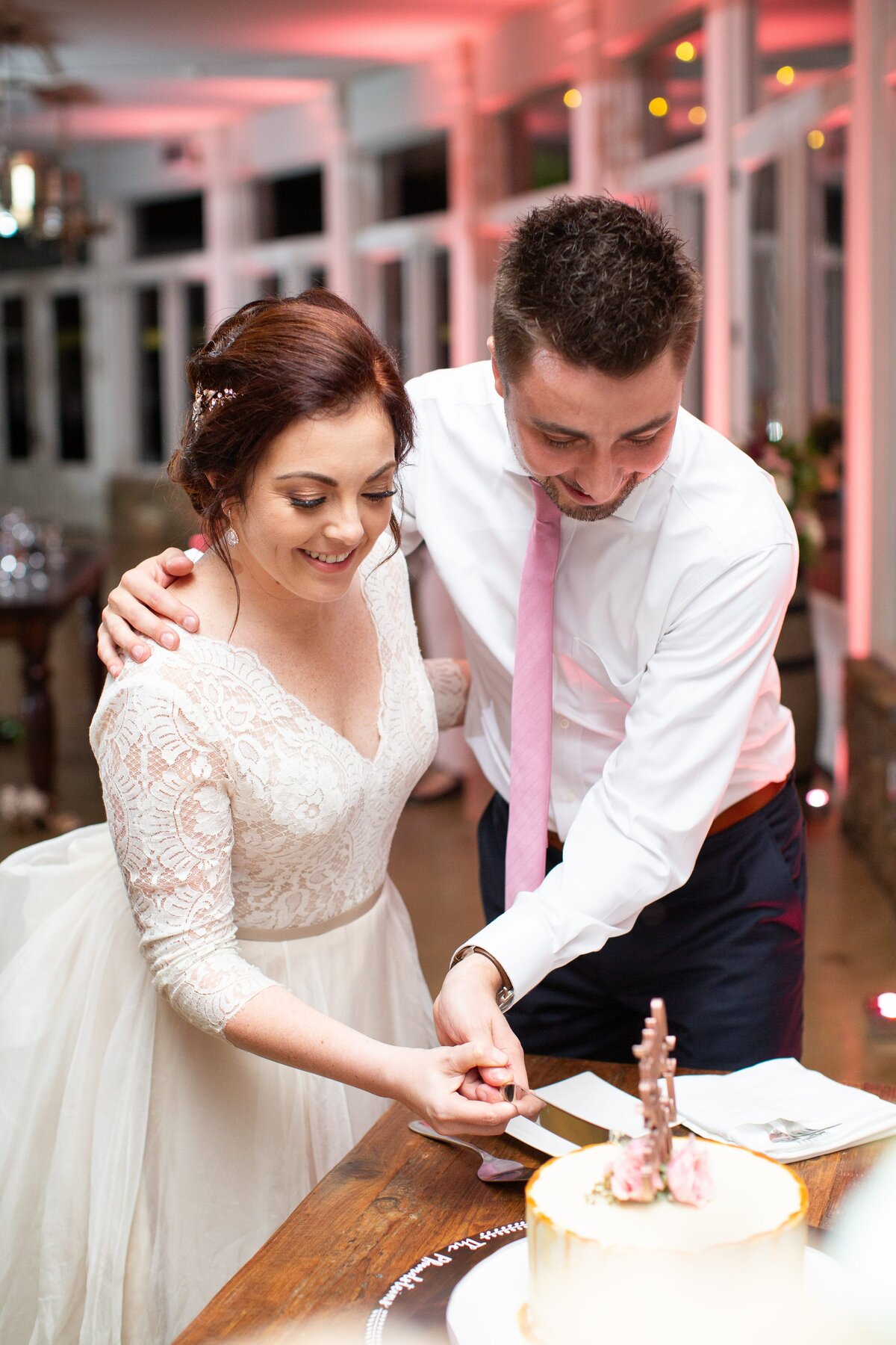 stone-tower-wedding-cake-cutting